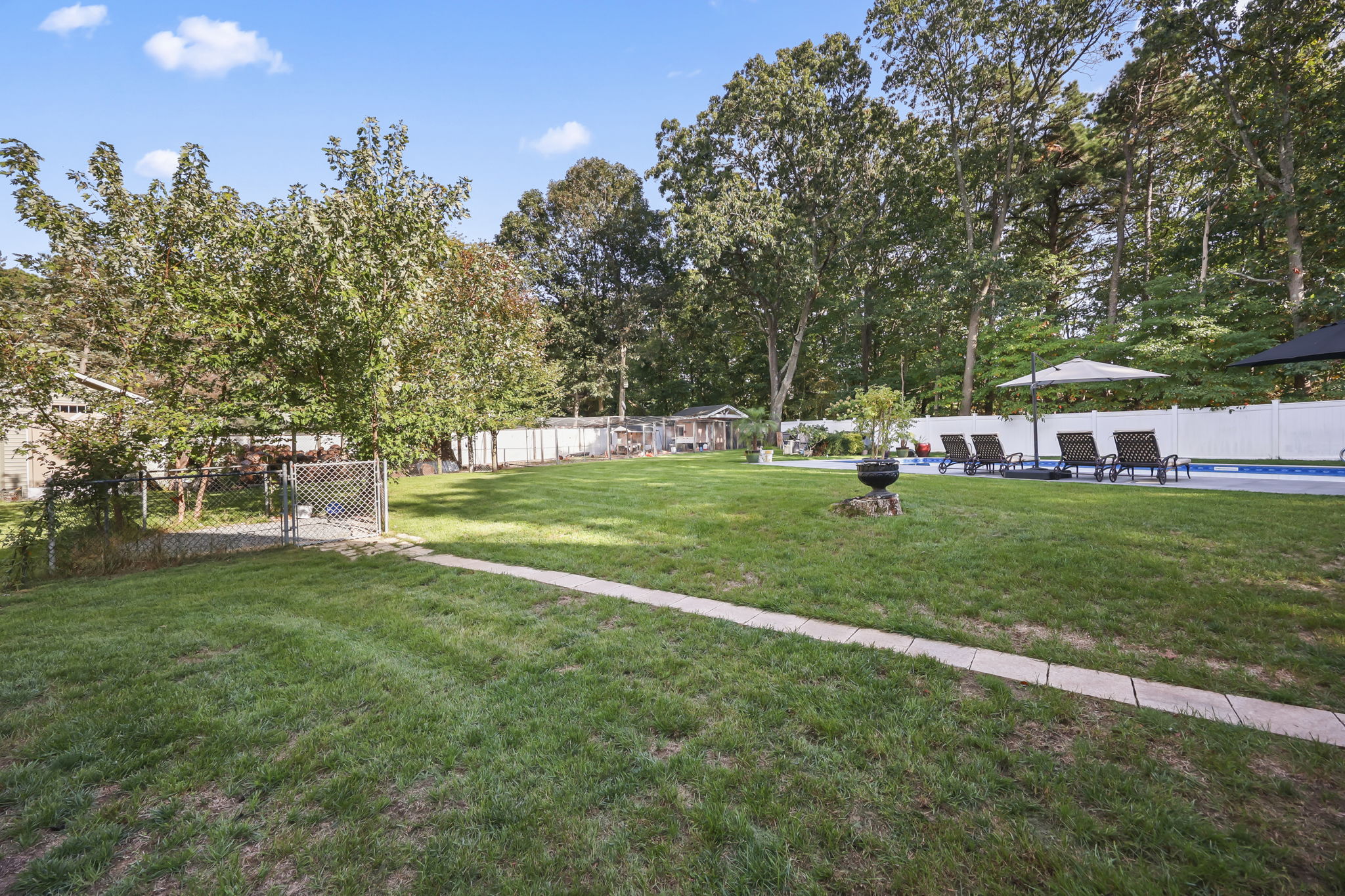 Backyard with pool and landscaping